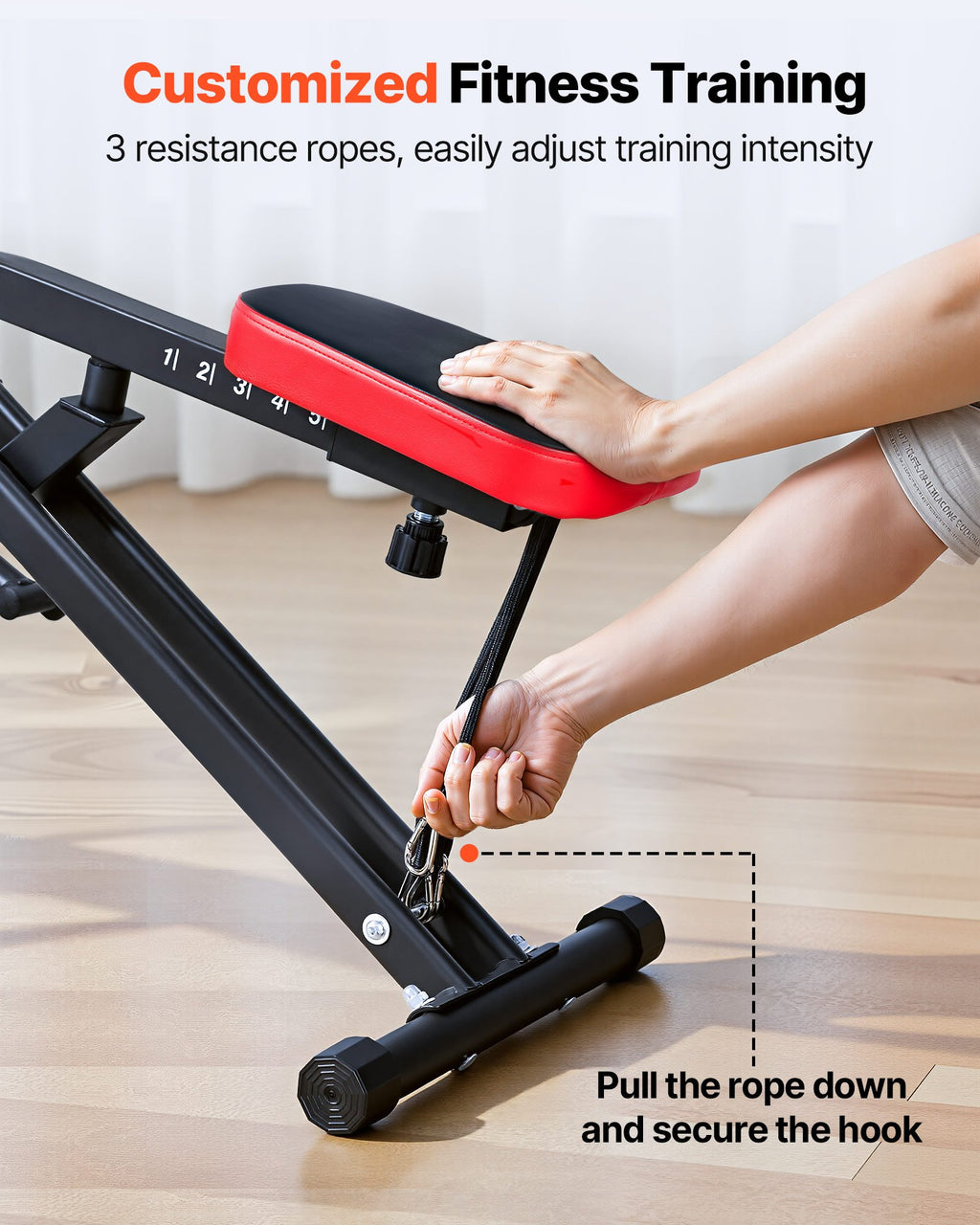 Close-up of the three resistance bands and securing hooks beneath the VEVOR squat trainer seat
