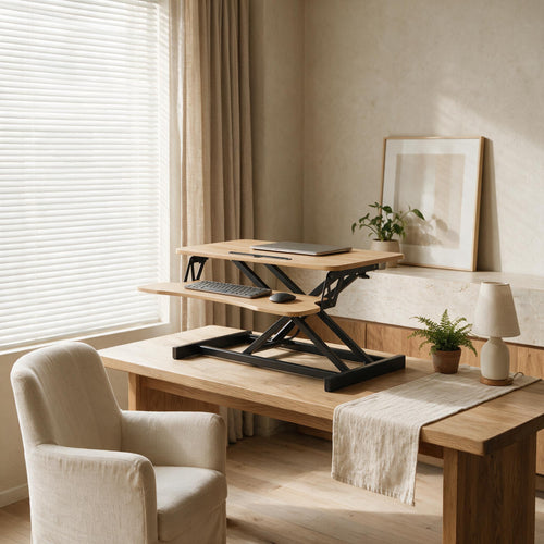 32-Inch Sit-Stand Desk Converter — styled in a warm neutral interior