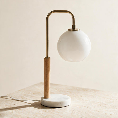 Auris Globe Table Lamp — full product in a warm ivory setting
