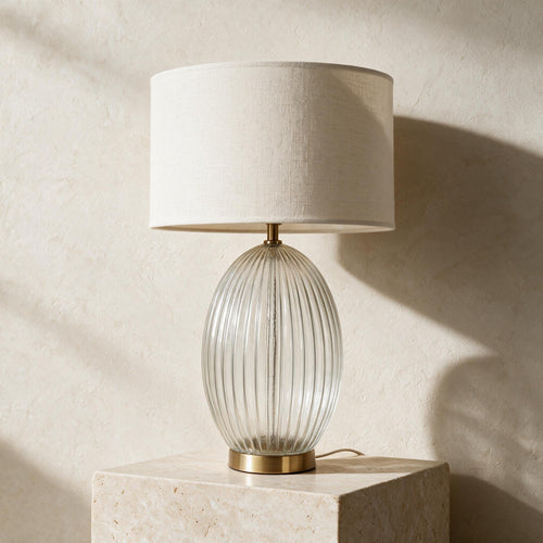 Aurora Ribbed Glass Table Lamp — full product in a warm ivory setting