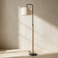 Lior Arc Floor Lamp — full product in a warm ivory setting