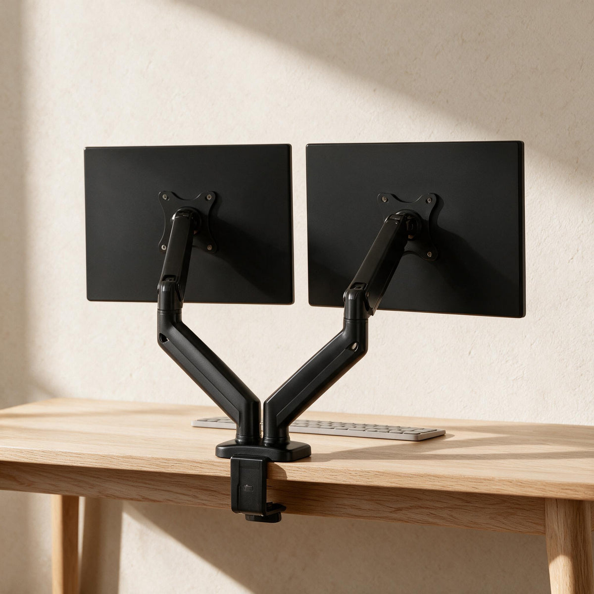 Dual Monitor Arm - 13–32-Inch Screens — styled in a warm neutral indoor setting.