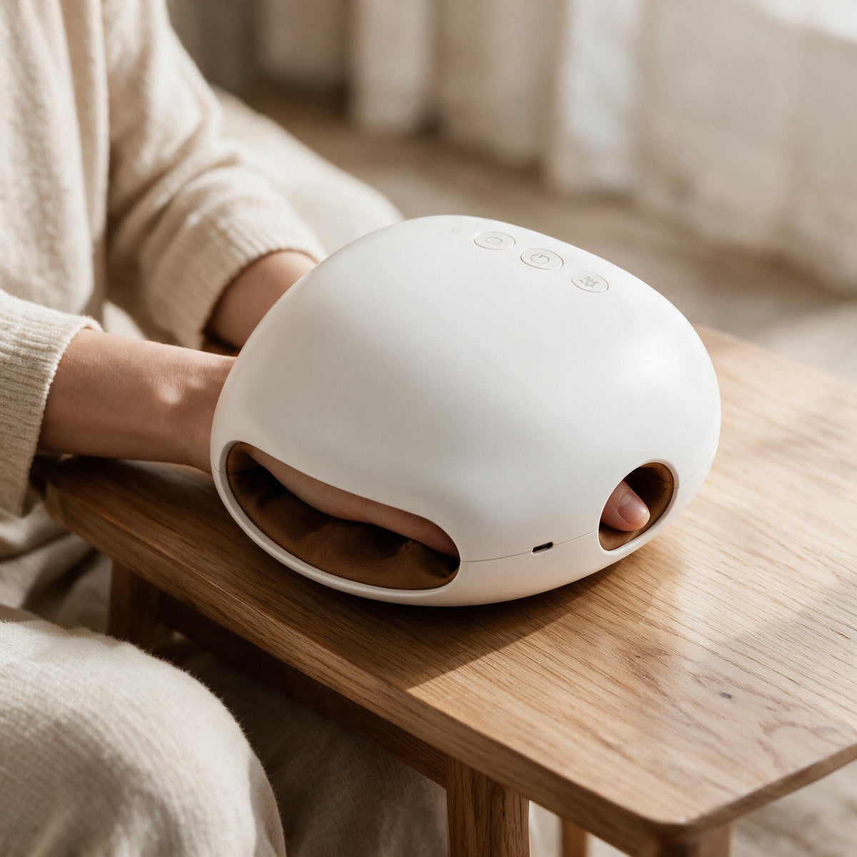 White Cordless Heated Hand Massager, in a calm home setting.