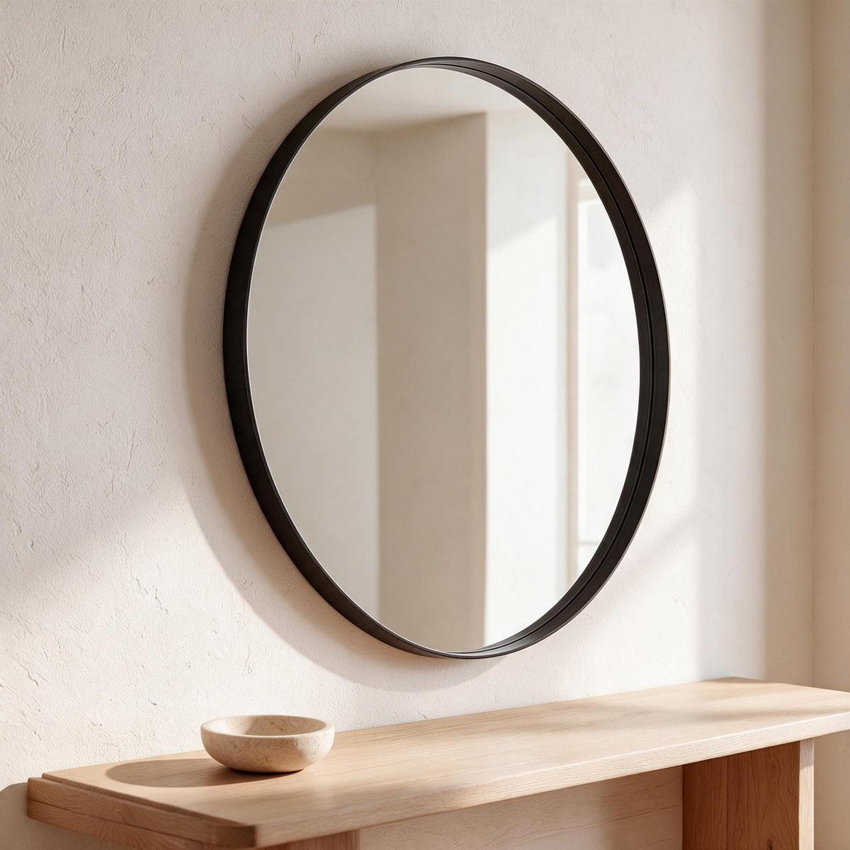 Round Metal Wall Mirror — Black, 28-Inch — in a calm home setting