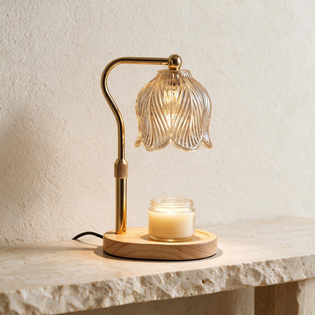 Gold Tulip Candle Warmer Lamp with a fluted glass shade and wooden base, warming an unlit jar candle.