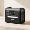 VEVOR Q2400Pro portable power station — three-quarter product view against warm ivory limestone.