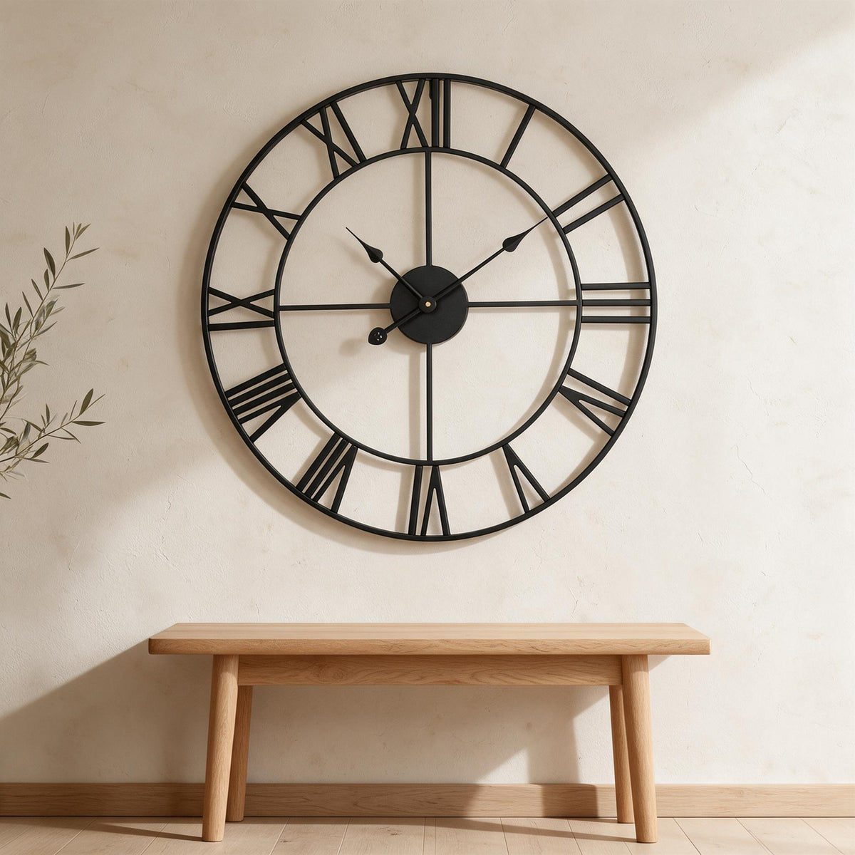 VEVOR Roman Numeral Wall Clock — Black, 24-Inch — in a warm neutral home setting; styling accessories not included